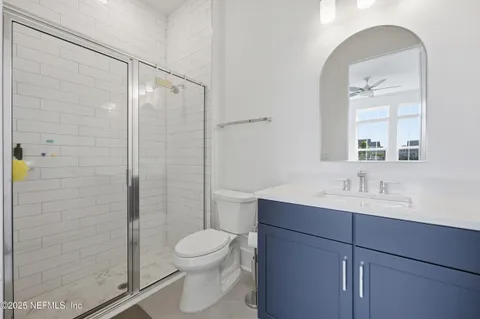 a bathroom with a toilet a sink and shower