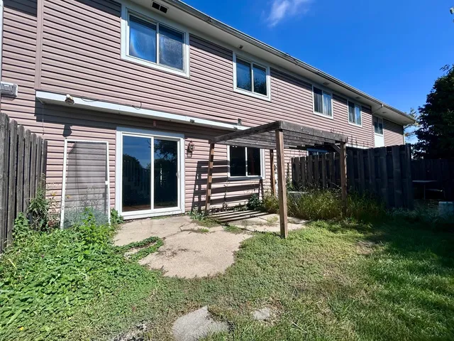 a house view with a backyard space