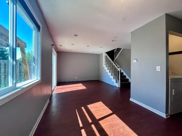 a view of entryway with wooden floor