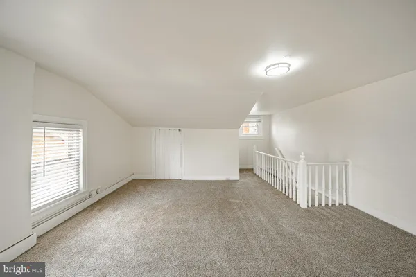 a view of a room with wooden walls