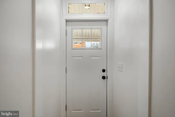 a view of entryway with wooden floor