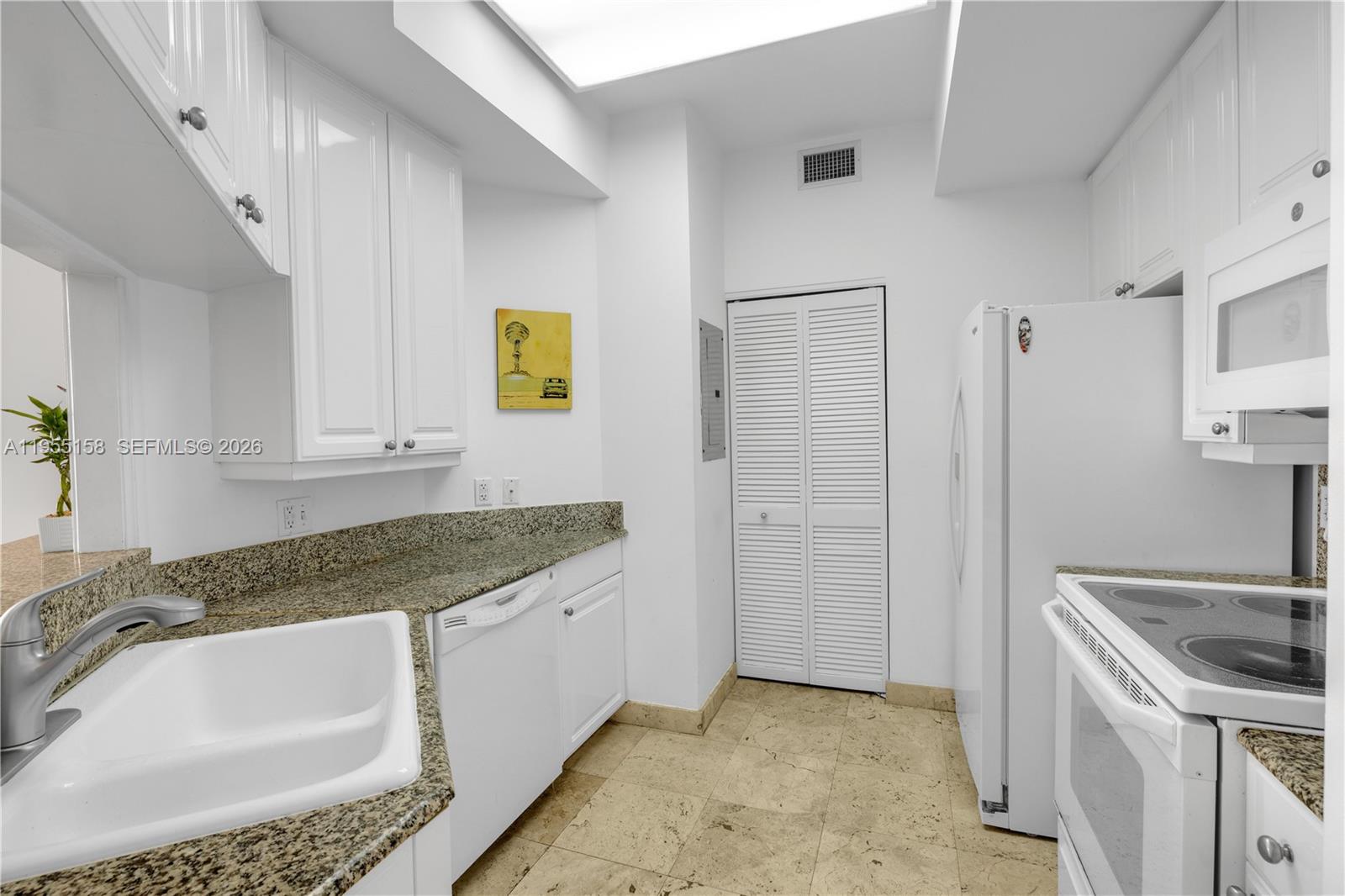 888 Brickell Key Drive, Unit 701 Miami, FL 33131 - Photo 11 of 20 a bathroom with a granite countertop sink and a mirror