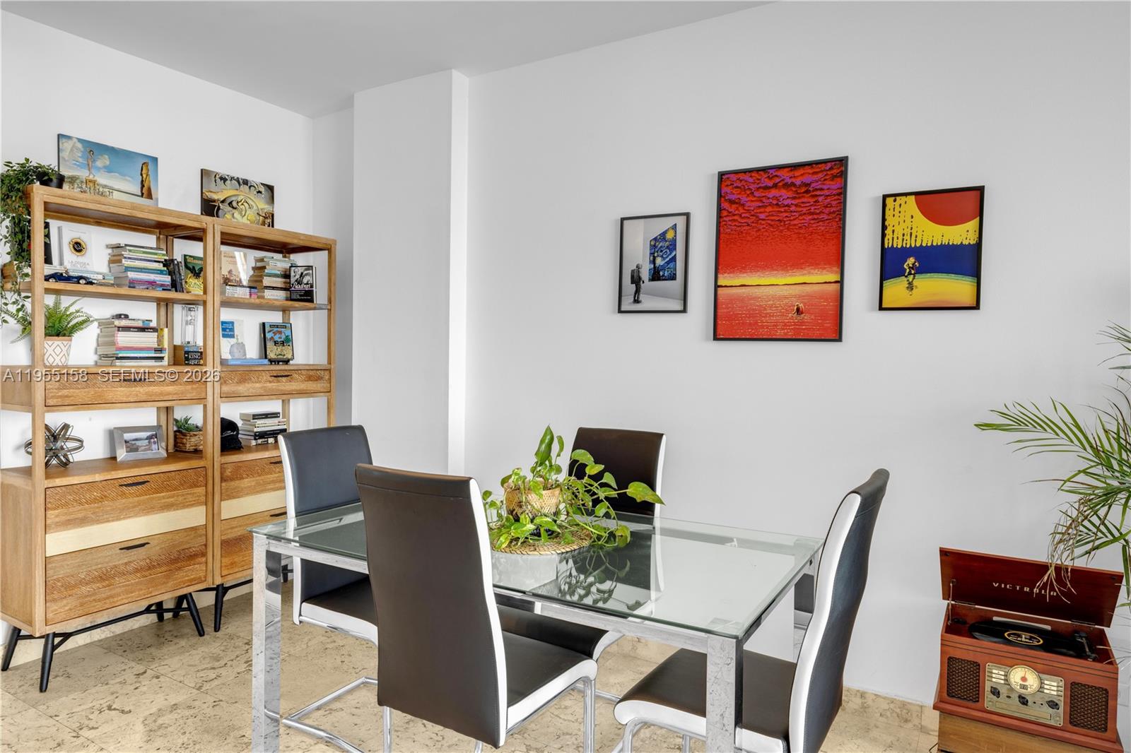 888 Brickell Key Drive, Unit 701 Miami, FL 33131 - Photo 14 of 20 a workspace with furniture and book shelf