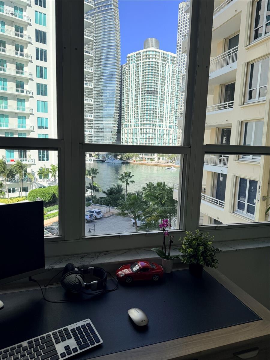 888 Brickell Key Drive, Unit 701 Miami, FL 33131 - Photo 15 of 20 a room with furniture and a window