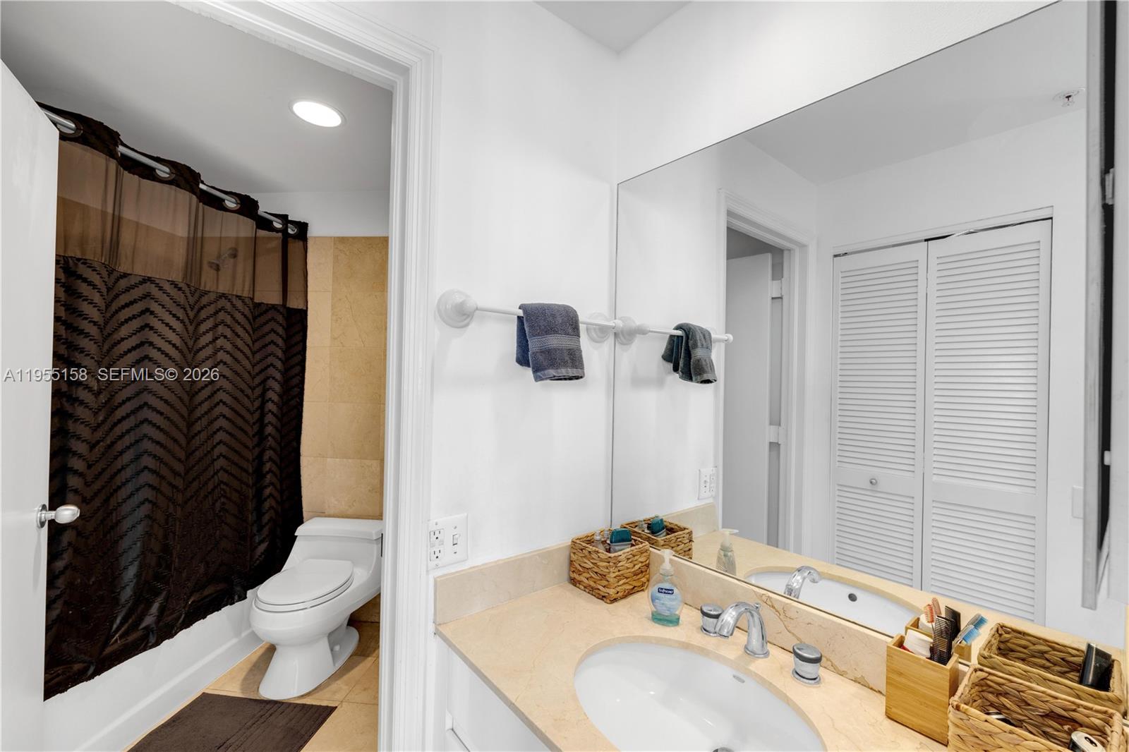 888 Brickell Key Drive, Unit 701 Miami, FL 33131 - Photo 20 of 20 a bathroom with a sink toilet and shower
