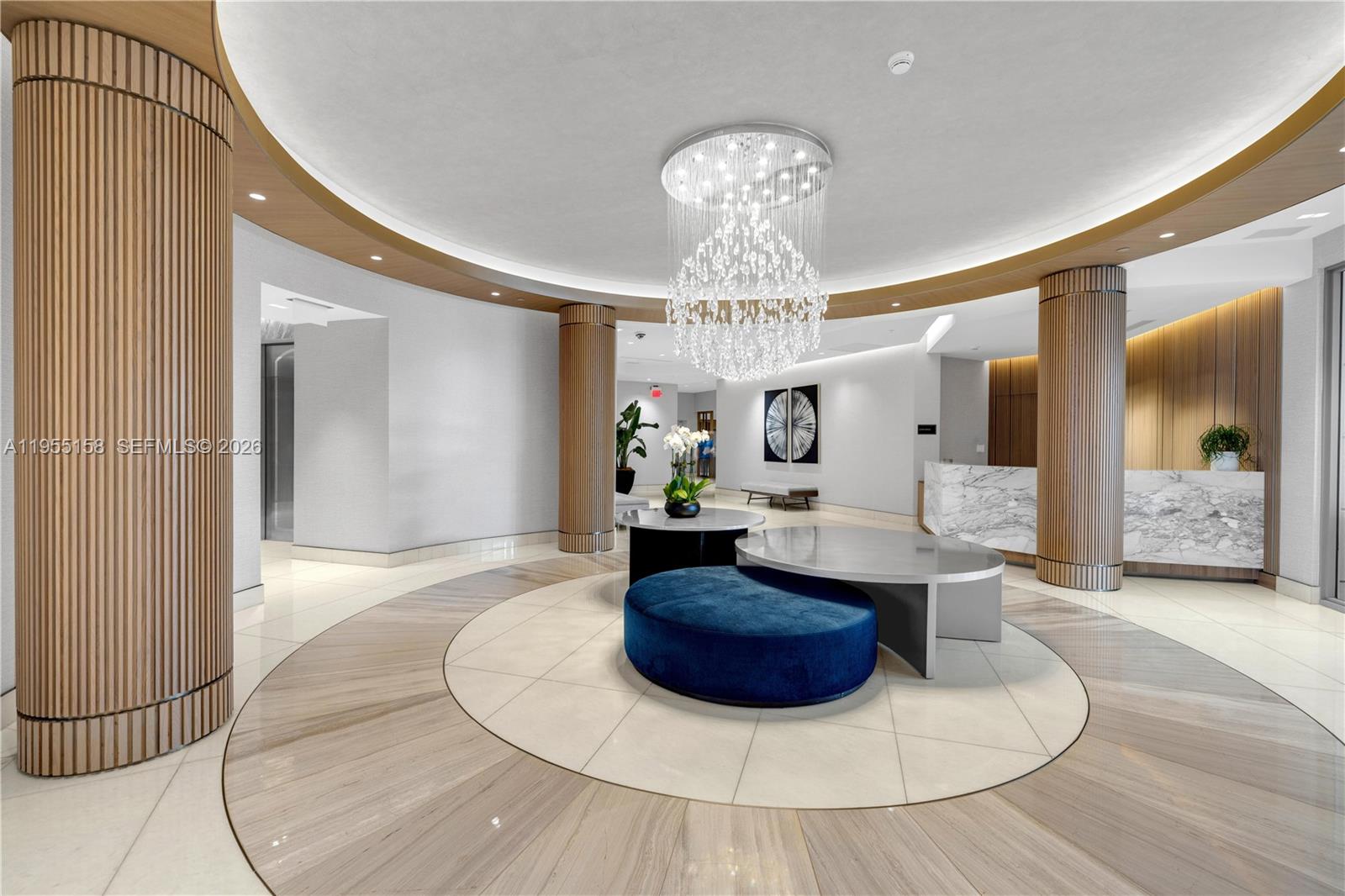 888 Brickell Key Drive, Unit 701 Miami, FL 33131 - Photo 2 of 20 a view of a livingroom with furniture and chandelier