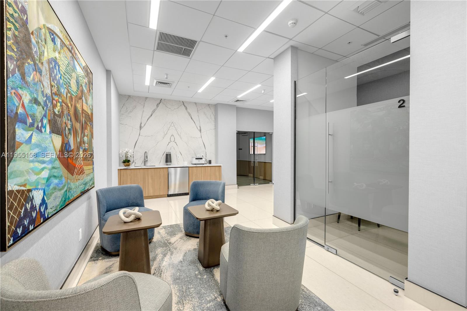 888 Brickell Key Drive, Unit 701 Miami, FL 33131 - Photo 3 of 20 a living room with furniture and a large window