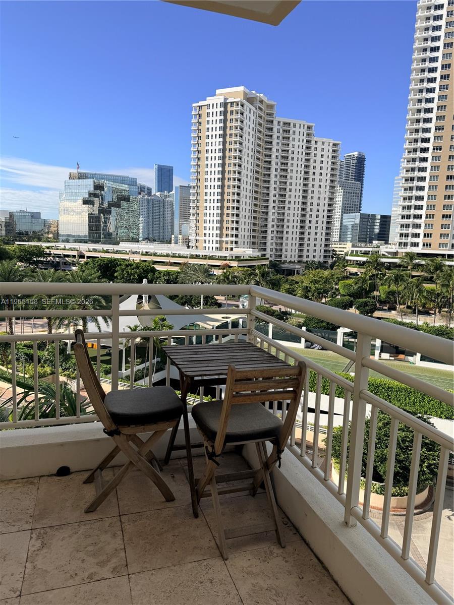 888 Brickell Key Drive, Unit 701 Miami, FL 33131 - Photo 4 of 20 a view of balcony with chairs and outdoor space