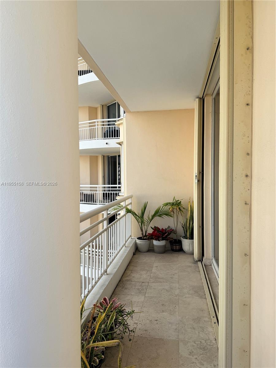 888 Brickell Key Drive, Unit 701 Miami, FL 33131 - Photo 5 of 20 a view of a hallway to a livingroom with furniture