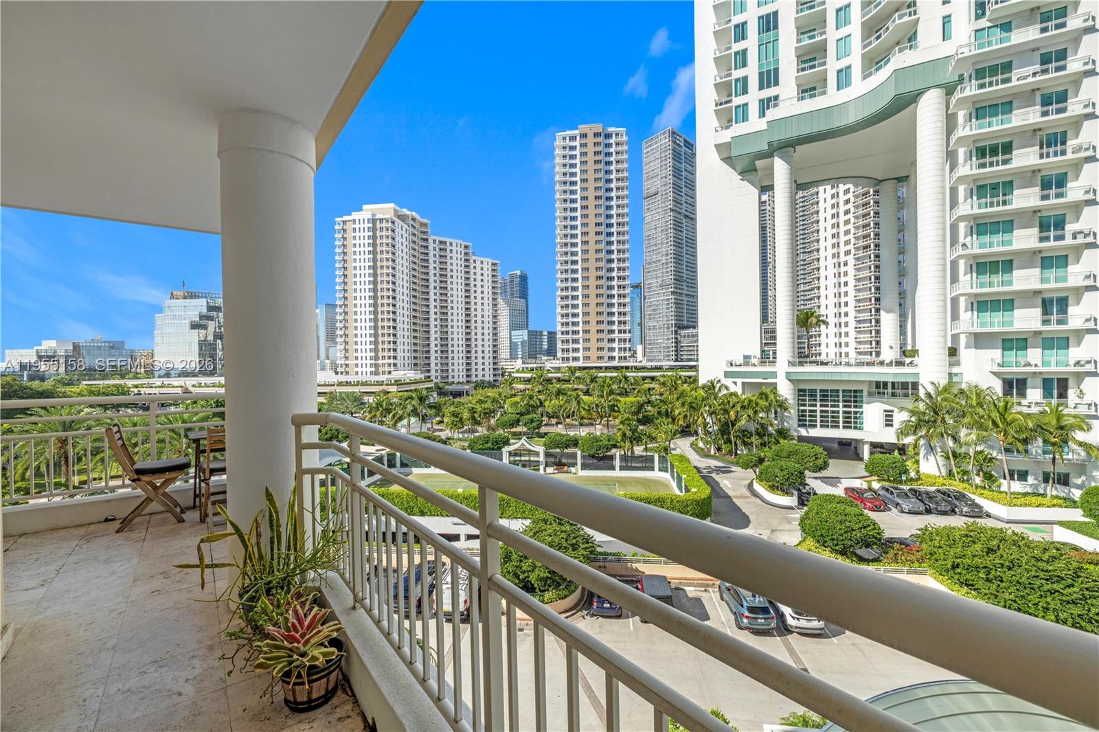 888 Brickell Key Drive, Unit 701 Miami, FL 33131 - Photo 6 of 20 a view of a balcony with chairs