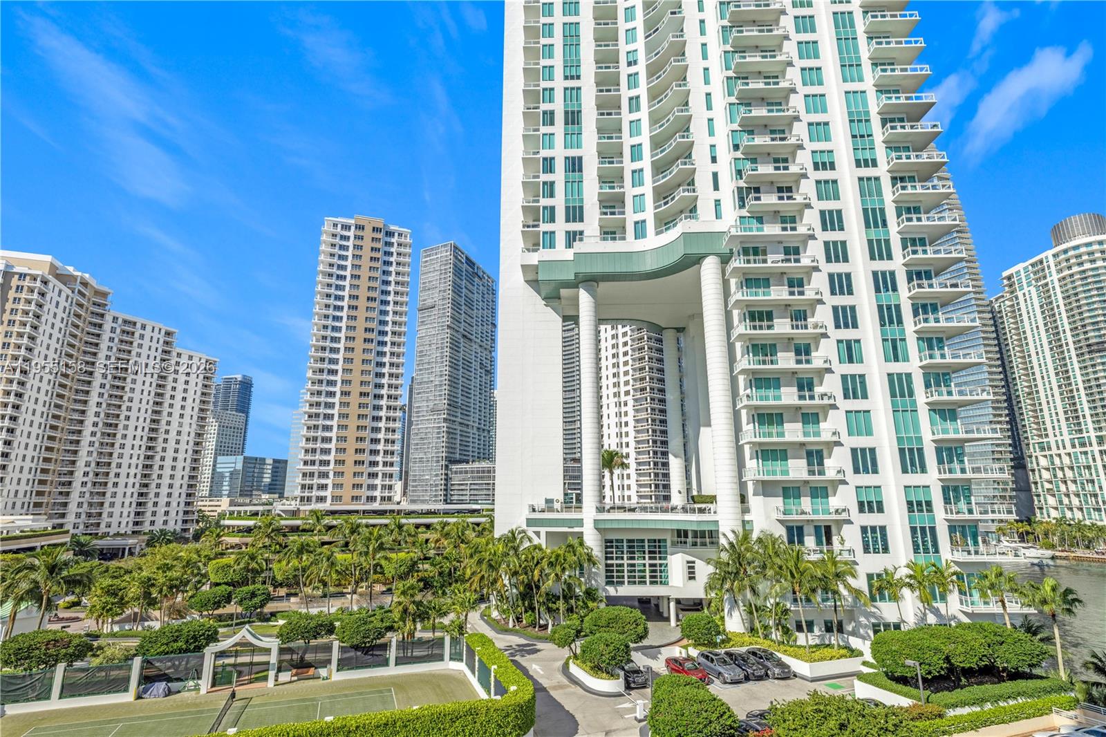 888 Brickell Key Drive, Unit 701 Miami, FL 33131 - Photo 8 of 20 a front view of a building with a garden
