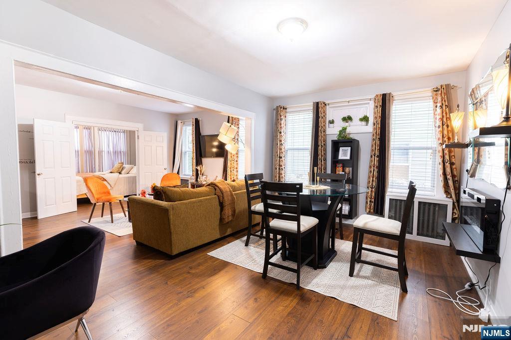 40-42 Harding Terrace Newark, NJ 07112 - Photo 4 of 15 a living room with furniture flat screen tv and wooden floor