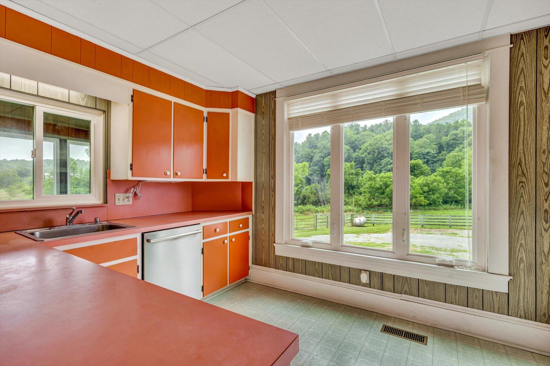 3567 Dillons Mill Road Callaway, VA 24067 - Photo 18 of 37 a kitchen with stainless steel appliances granite countertop a sink and a stove