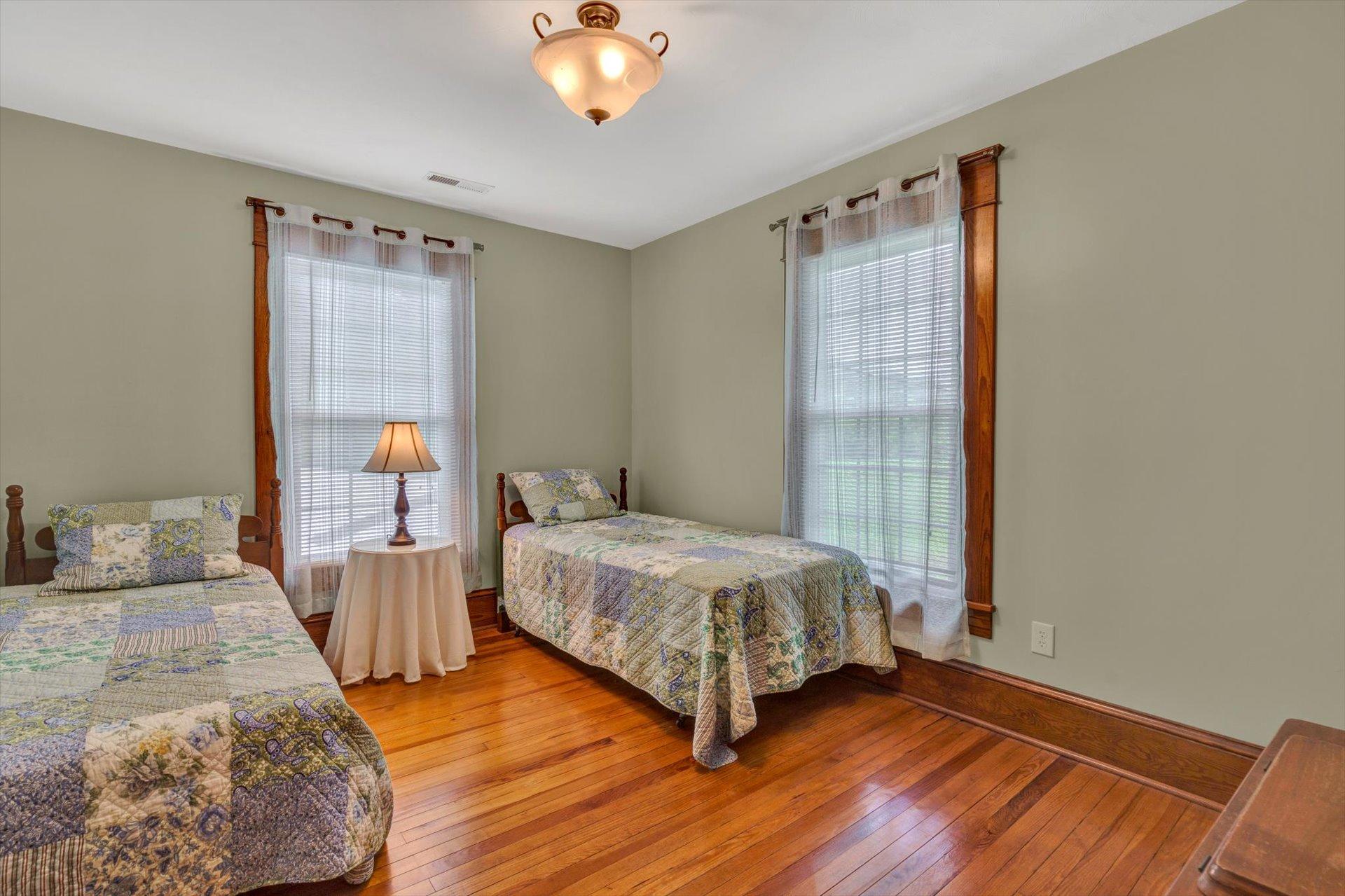 3567 Dillons Mill Road Callaway, VA 24067 - Photo 28 of 37 a bedroom with a bed and wooden floor