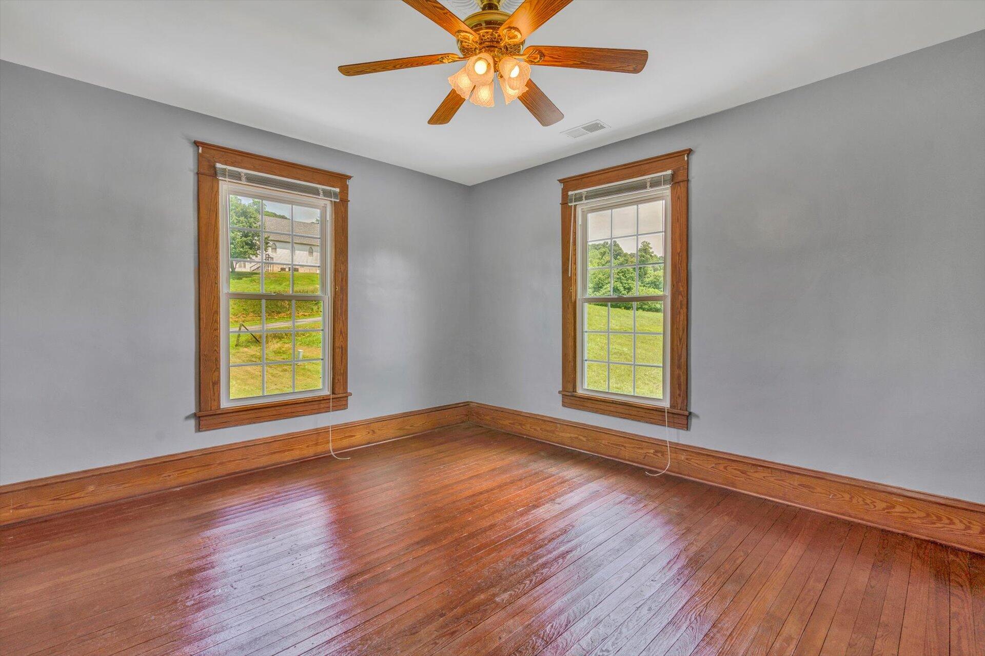 3567 Dillons Mill Road Callaway, VA 24067 - Photo 29 of 37 a view of an empty room with window and wooden floor