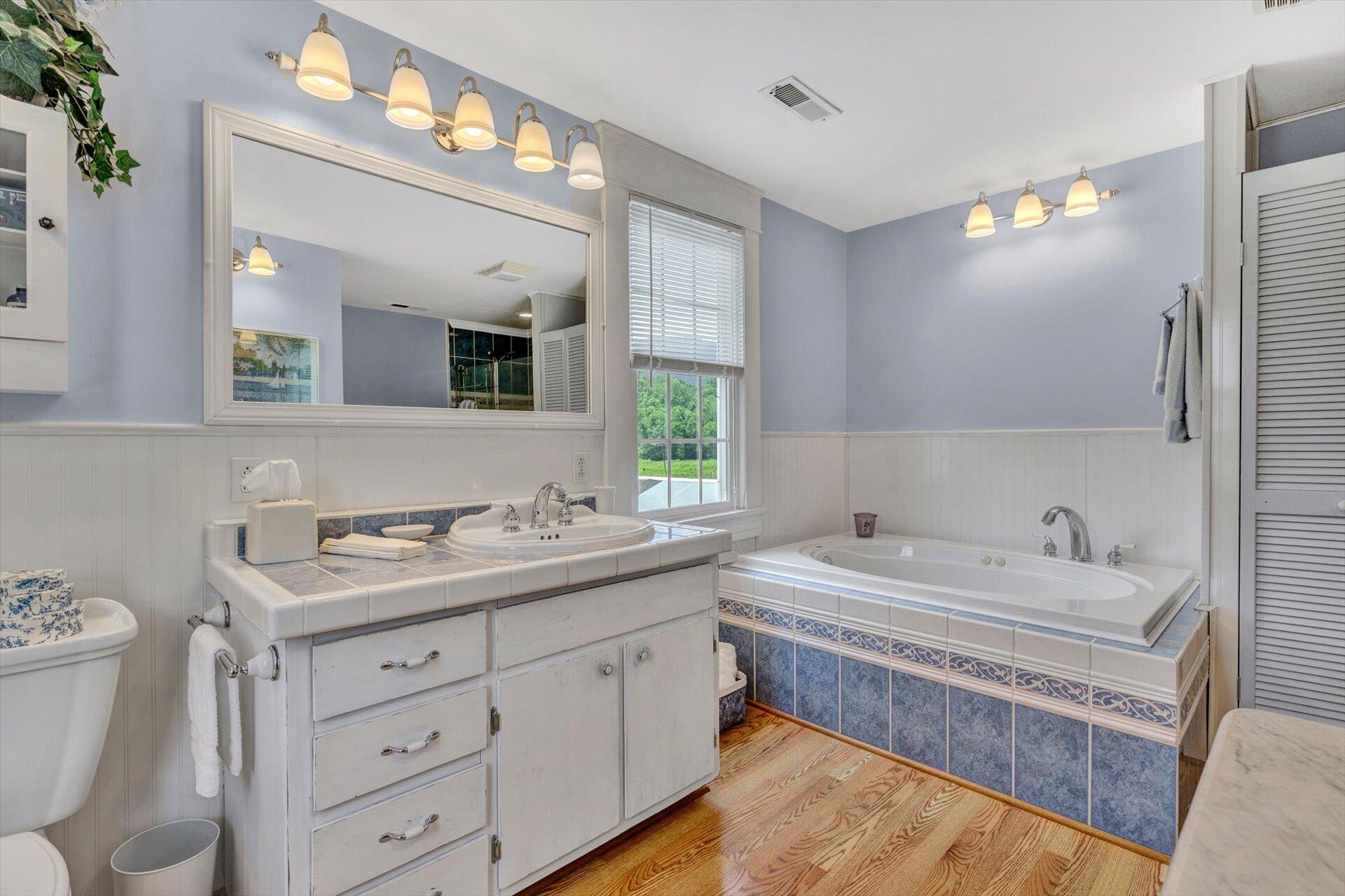 3567 Dillons Mill Road Callaway, VA 24067 - Photo 30 of 37 a bathroom with a double vanity sink and a mirror