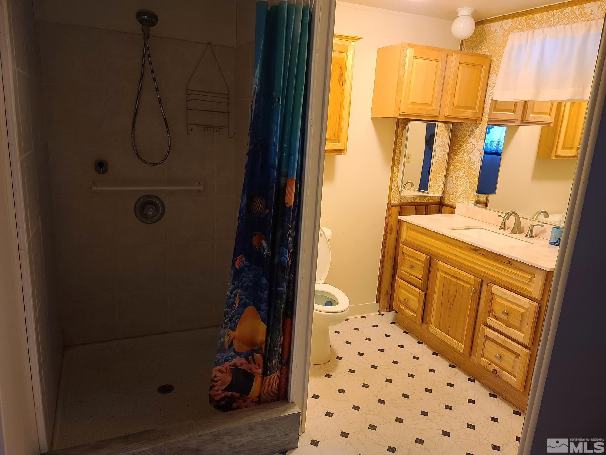 315 Capella Drive Reno, NV 89521 - Photo 14 of 15 a bathroom with a sink toilet and shower