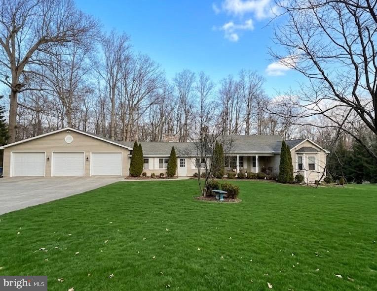 1302 Blue Mt Road Monkton, MD 21111 - Photo 1 of 1 a front view of house with yard and trees