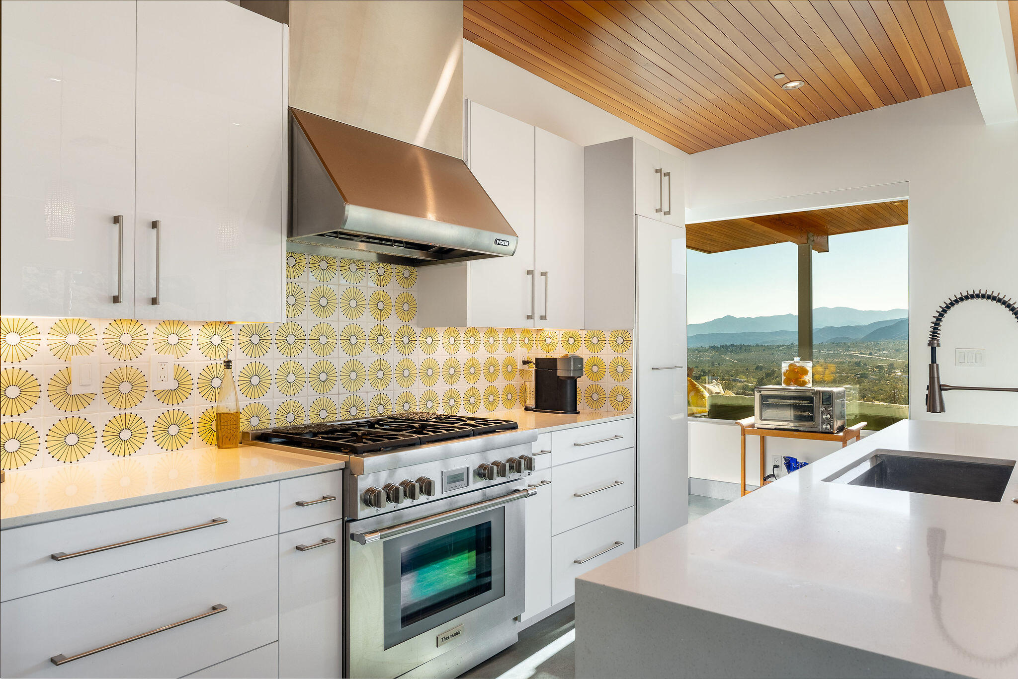 53145 Northridge Road Morongo Valley, CA 92256 - Photo 12 of 48 a kitchen with stainless steel appliances a stove a sink and a refrigerator