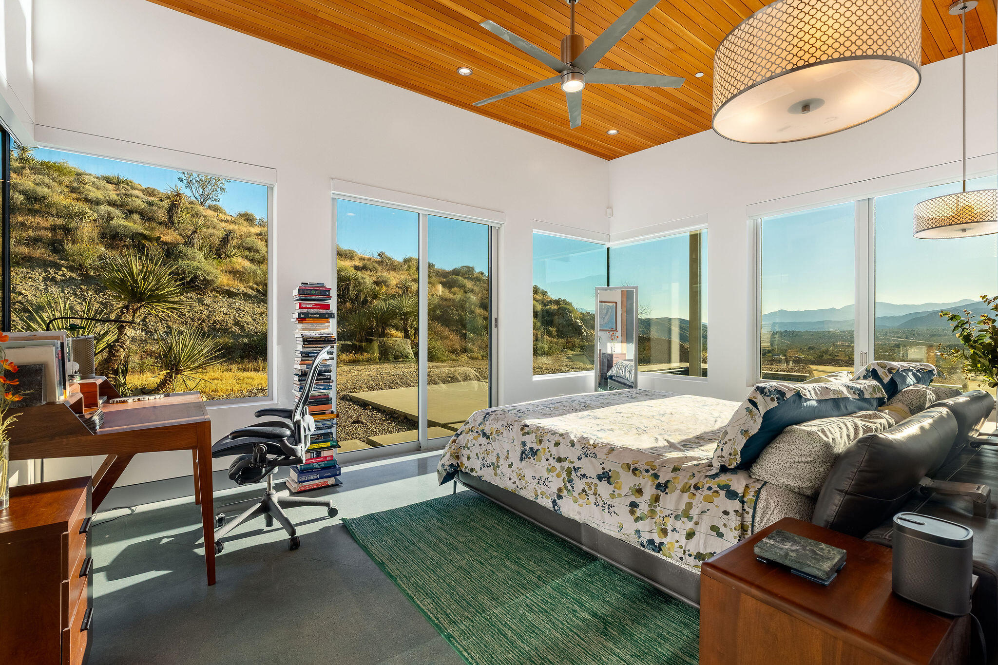 53145 Northridge Road Morongo Valley, CA 92256 - Photo 16 of 48 a bed room with a bed and a large window