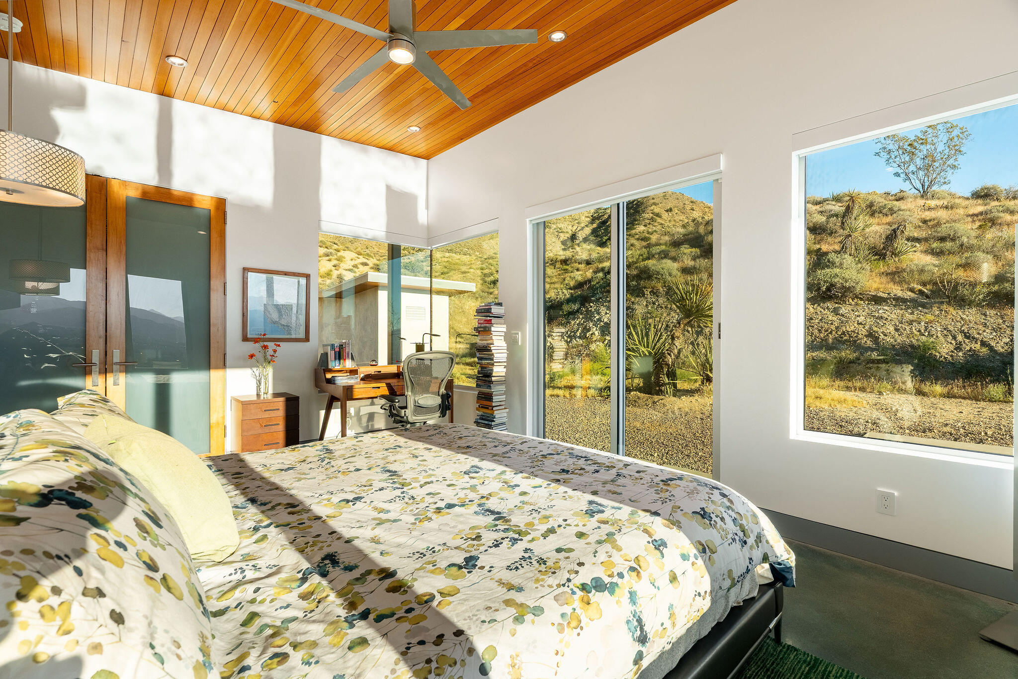 53145 Northridge Road Morongo Valley, CA 92256 - Photo 17 of 48 a bed sitting in a bedroom next to a window