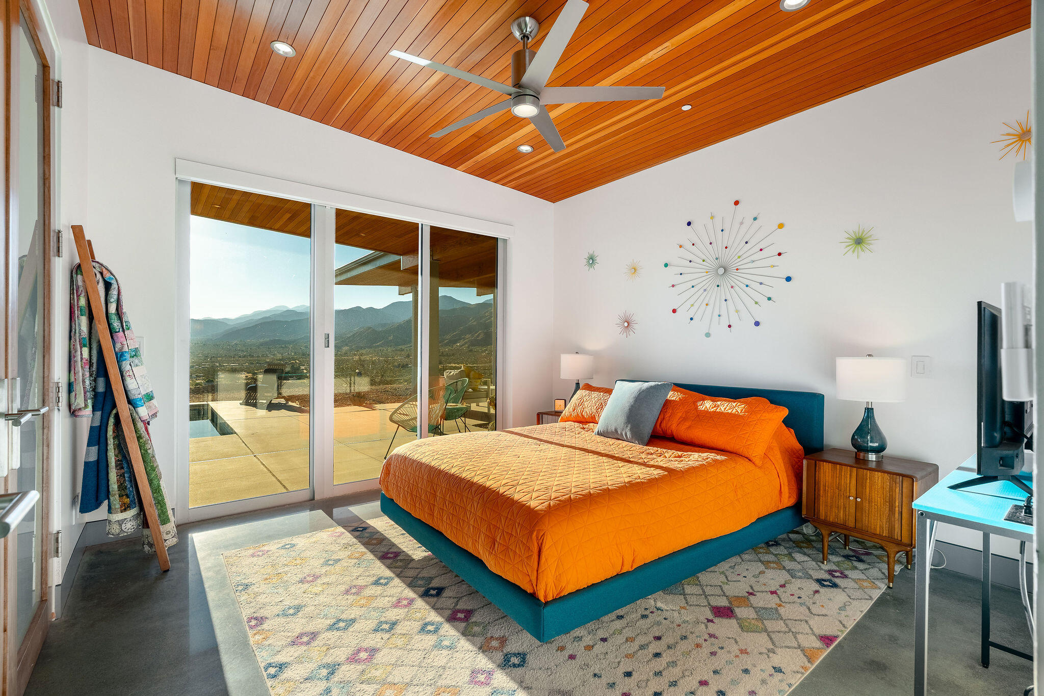 53145 Northridge Road Morongo Valley, CA 92256 - Photo 19 of 48 a bedroom with a bed and wooden floor