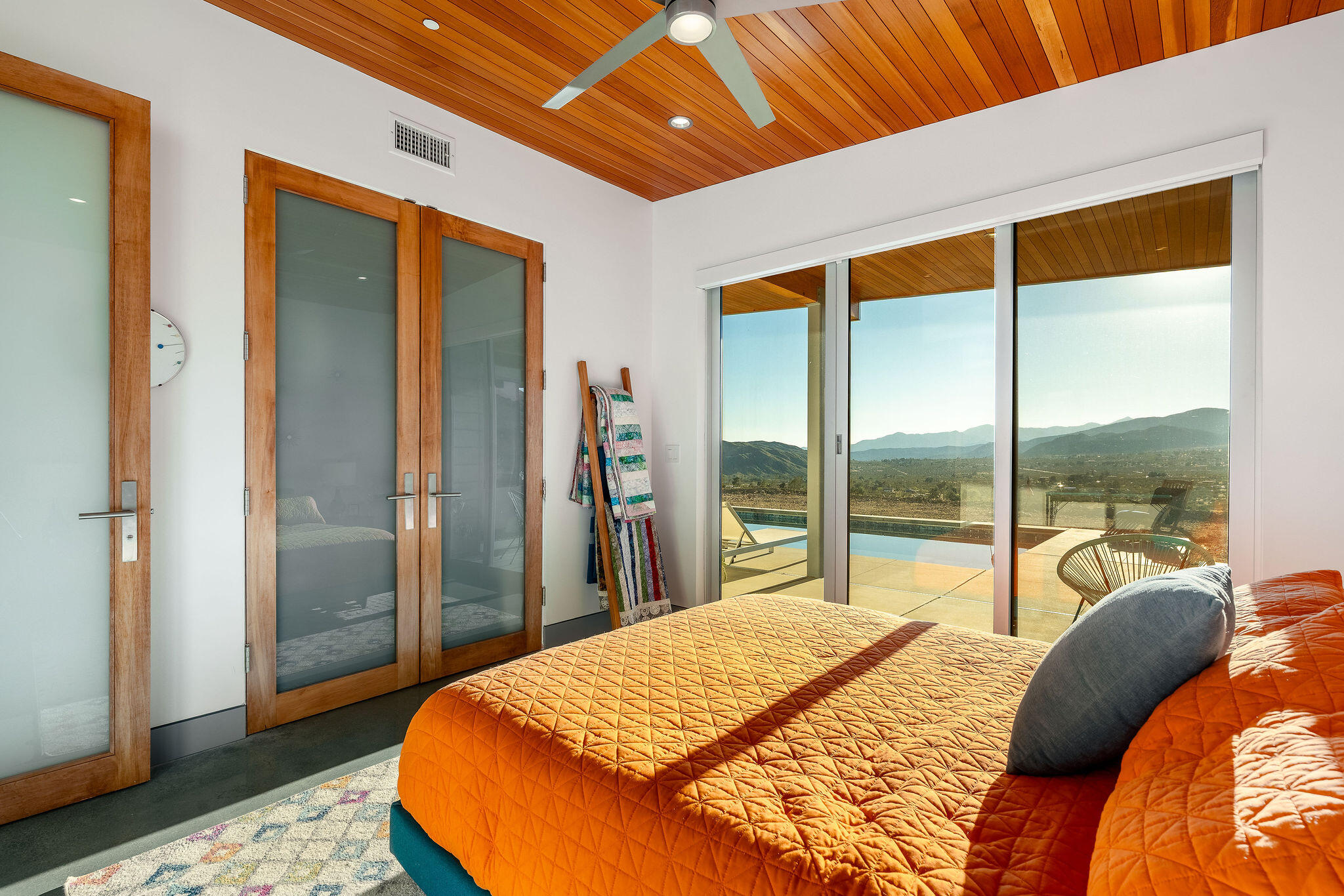 53145 Northridge Road Morongo Valley, CA 92256 - Photo 20 of 48 a bedroom with a bed and a large window