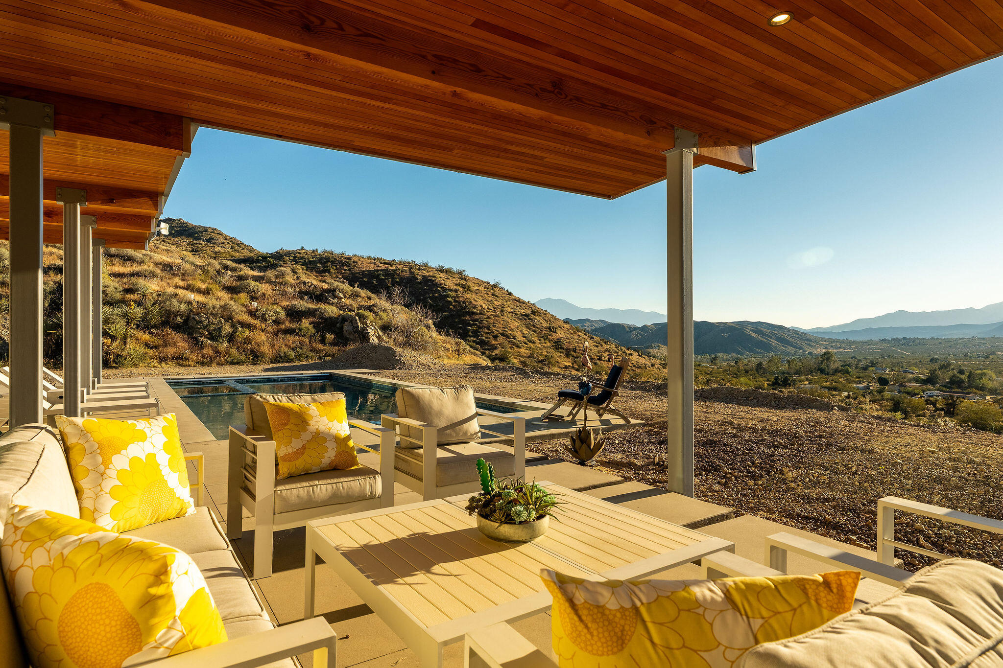 53145 Northridge Road Morongo Valley, CA 92256 - Photo 25 of 48 a view of a balcony with table and chairs