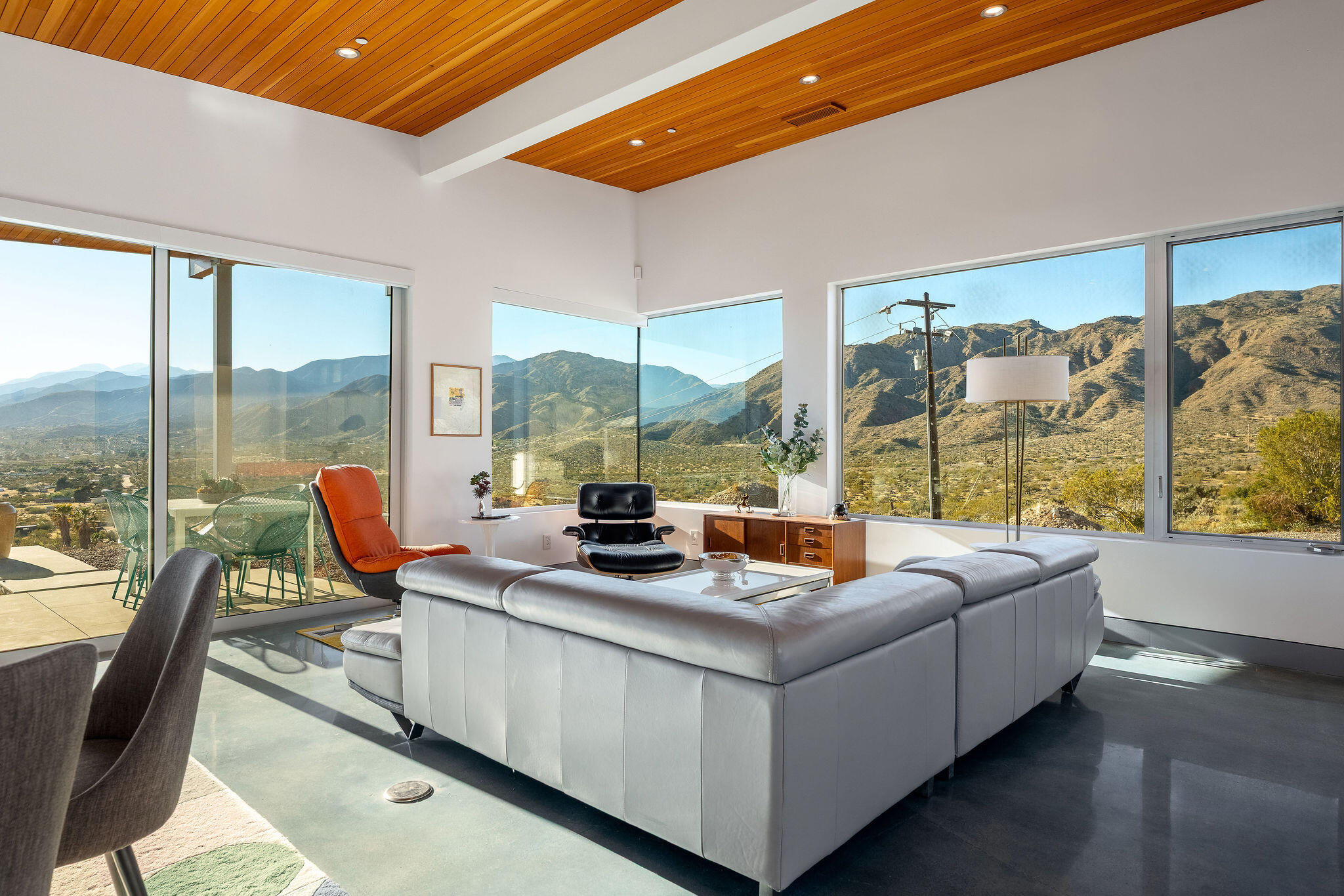 53145 Northridge Road Morongo Valley, CA 92256 - Photo 3 of 48 a living room with furniture and a floor to ceiling window