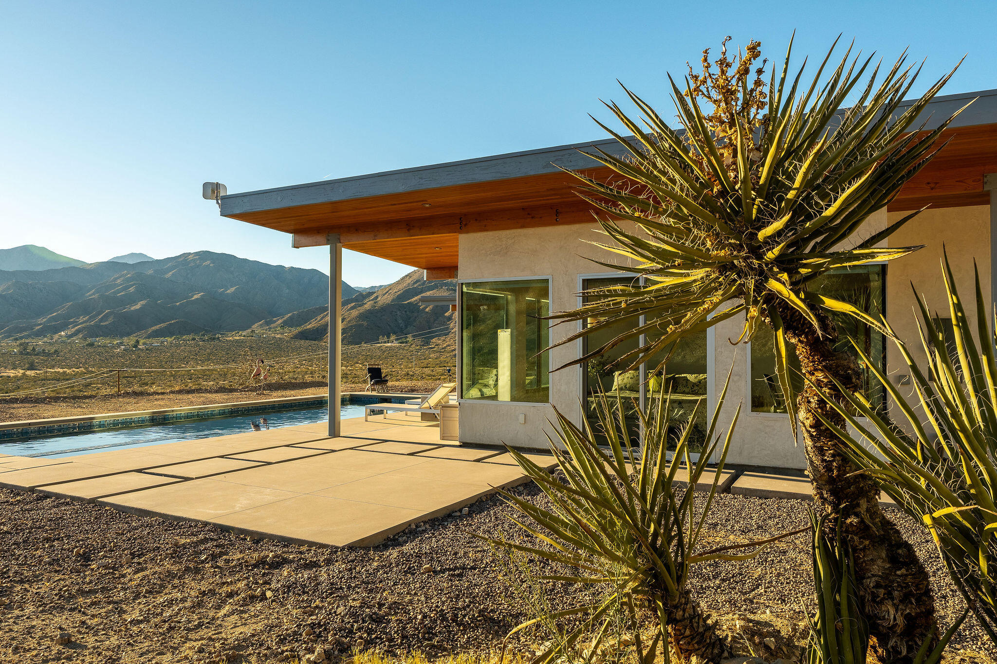 53145 Northridge Road Morongo Valley, CA 92256 - Photo 36 of 48 a view of a house with backyard and a patio