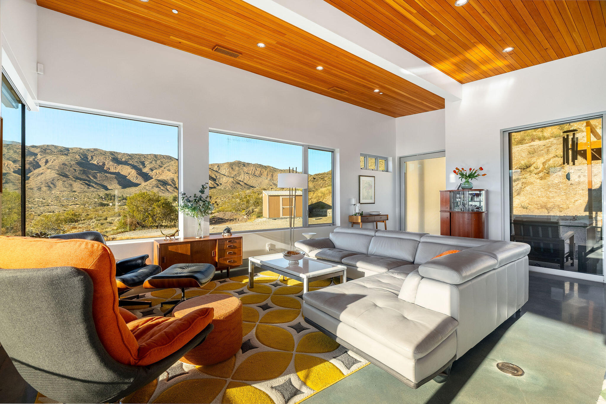 53145 Northridge Road Morongo Valley, CA 92256 - Photo 6 of 48 a living room with furniture kitchen view and a large window
