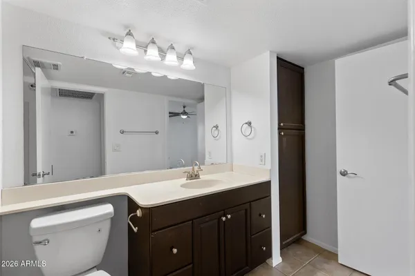 a bathroom with a sink vanity and a mirror