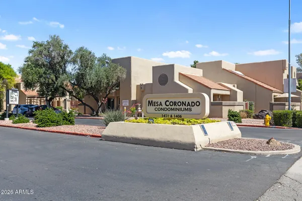 a view of a house with outdoor space and sitting area