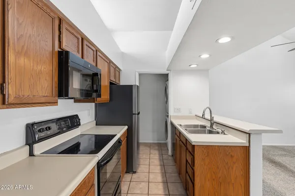 a kitchen that has a sink and a stove in it