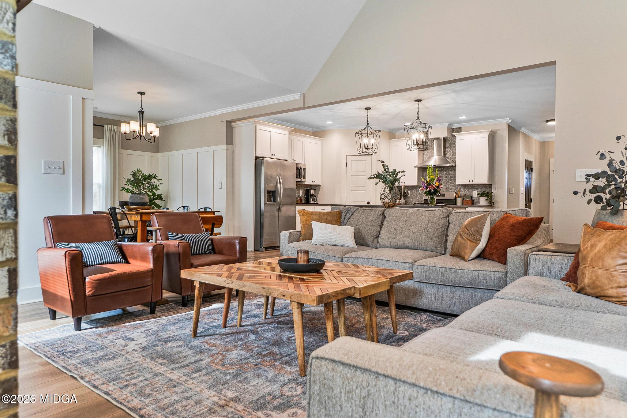 155 Creekside Lane Forsyth, GA 31029 - Photo 13 of 43 a living room with furniture and a chandelier