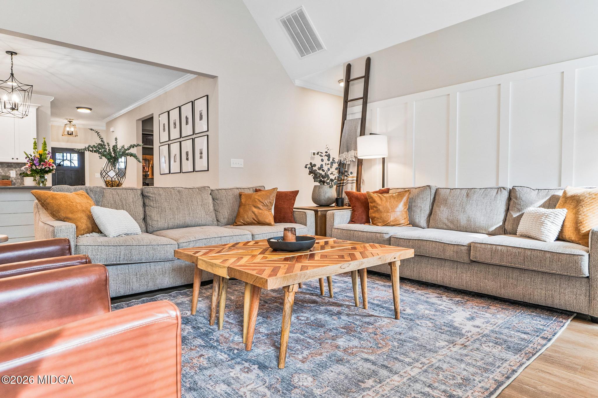 155 Creekside Lane Forsyth, GA 31029 - Photo 14 of 43 a living room with furniture and wooden floor