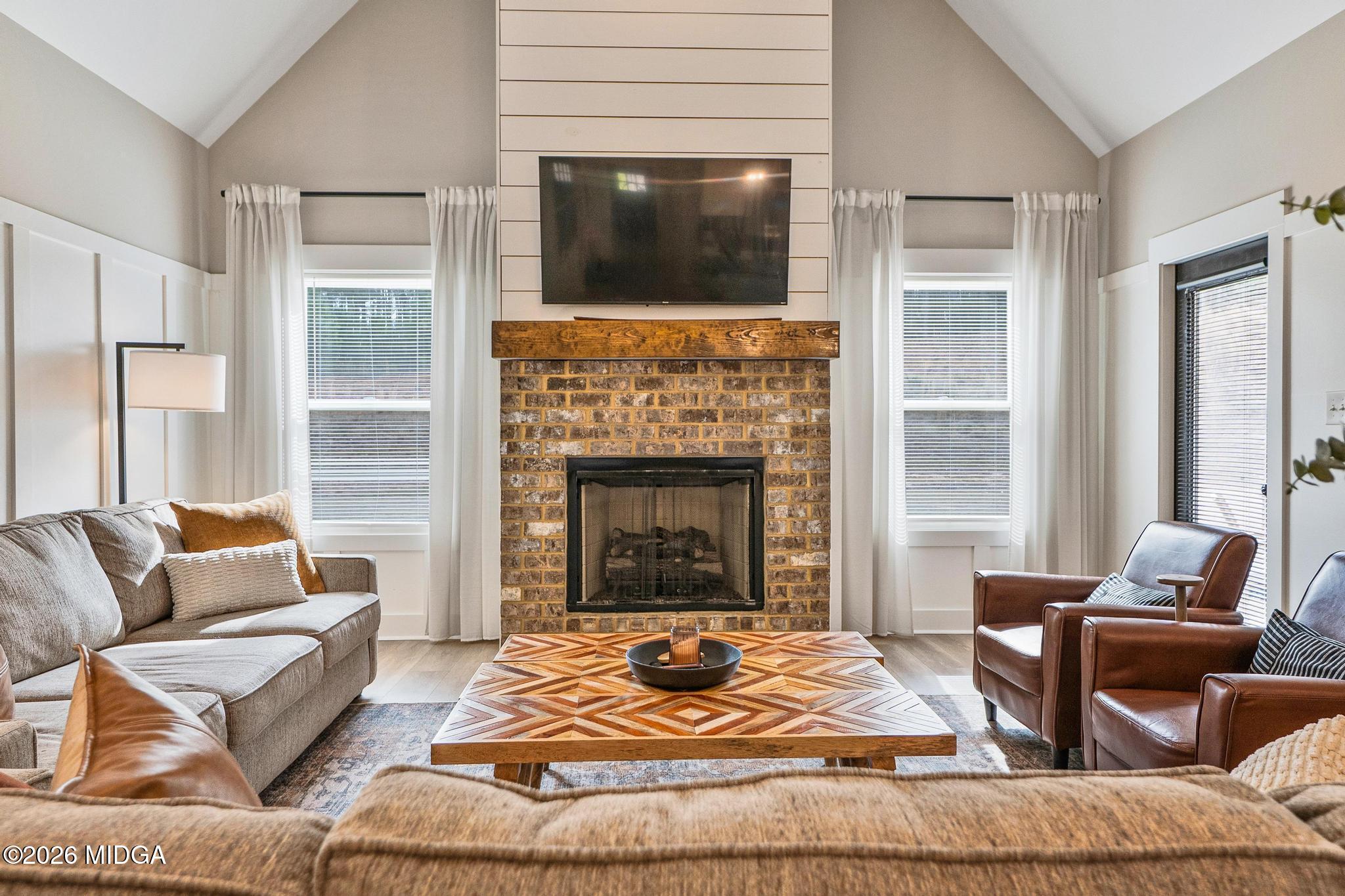 155 Creekside Lane Forsyth, GA 31029 - Photo 15 of 43 a living room with furniture and a fireplace