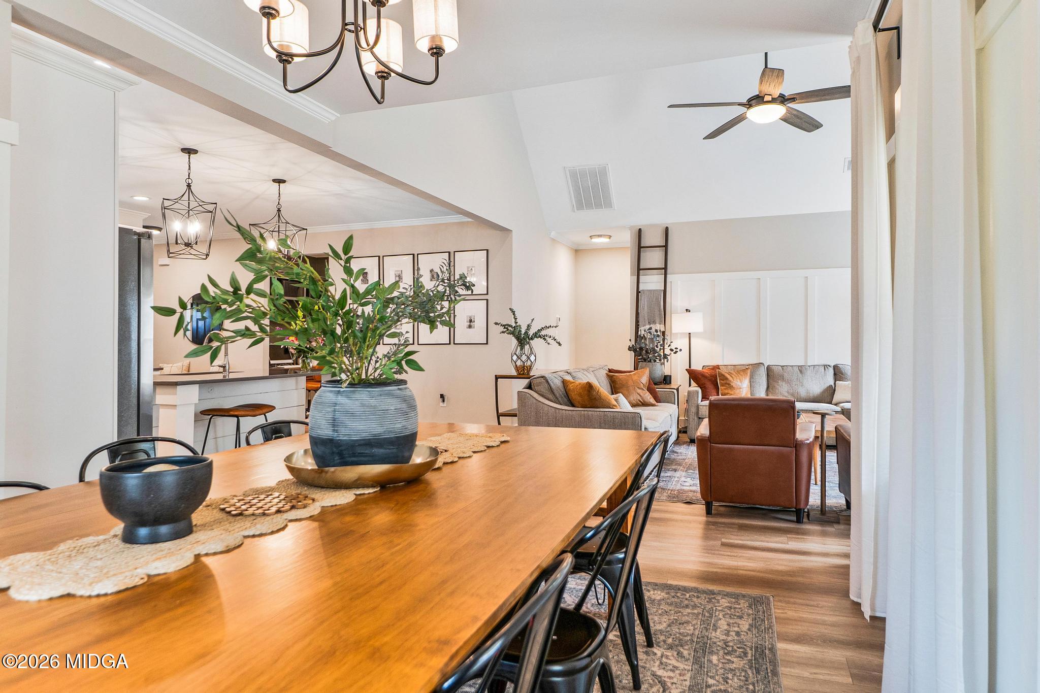 155 Creekside Lane Forsyth, GA 31029 - Photo 16 of 43 a dining room with furniture and potted plants