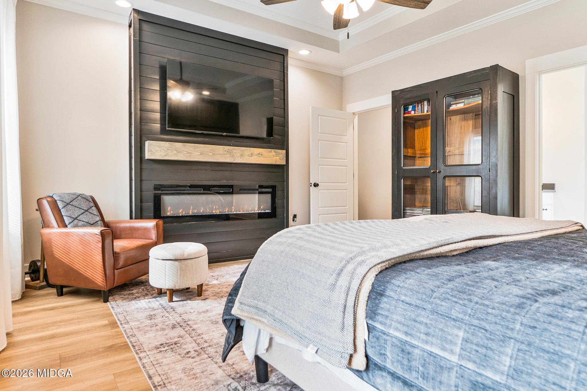 155 Creekside Lane Forsyth, GA 31029 - Photo 19 of 43 a spacious bedroom with a bed and a flat screen tv