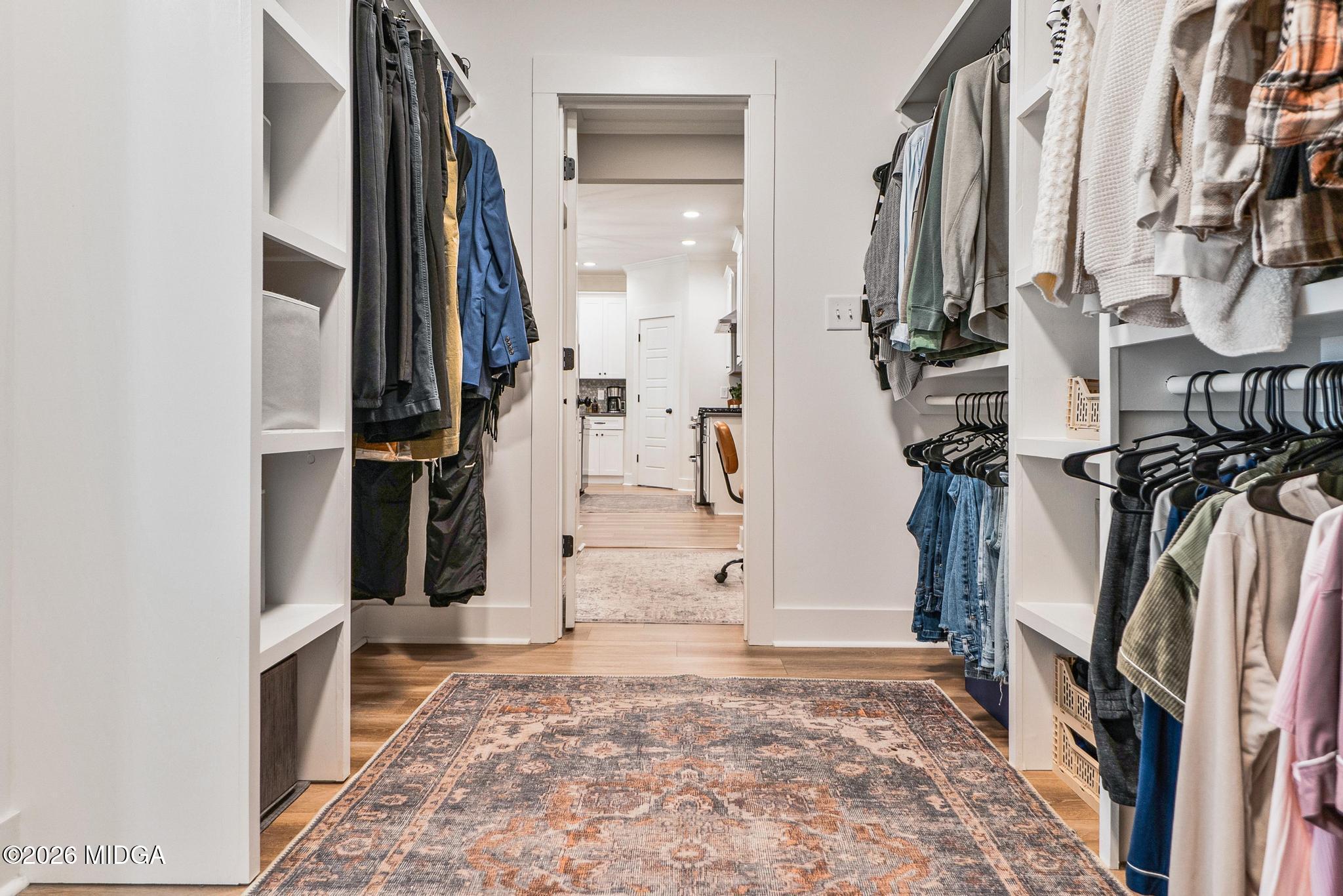 155 Creekside Lane Forsyth, GA 31029 - Photo 23 of 43 a view of walk in closet with clothes and shoes