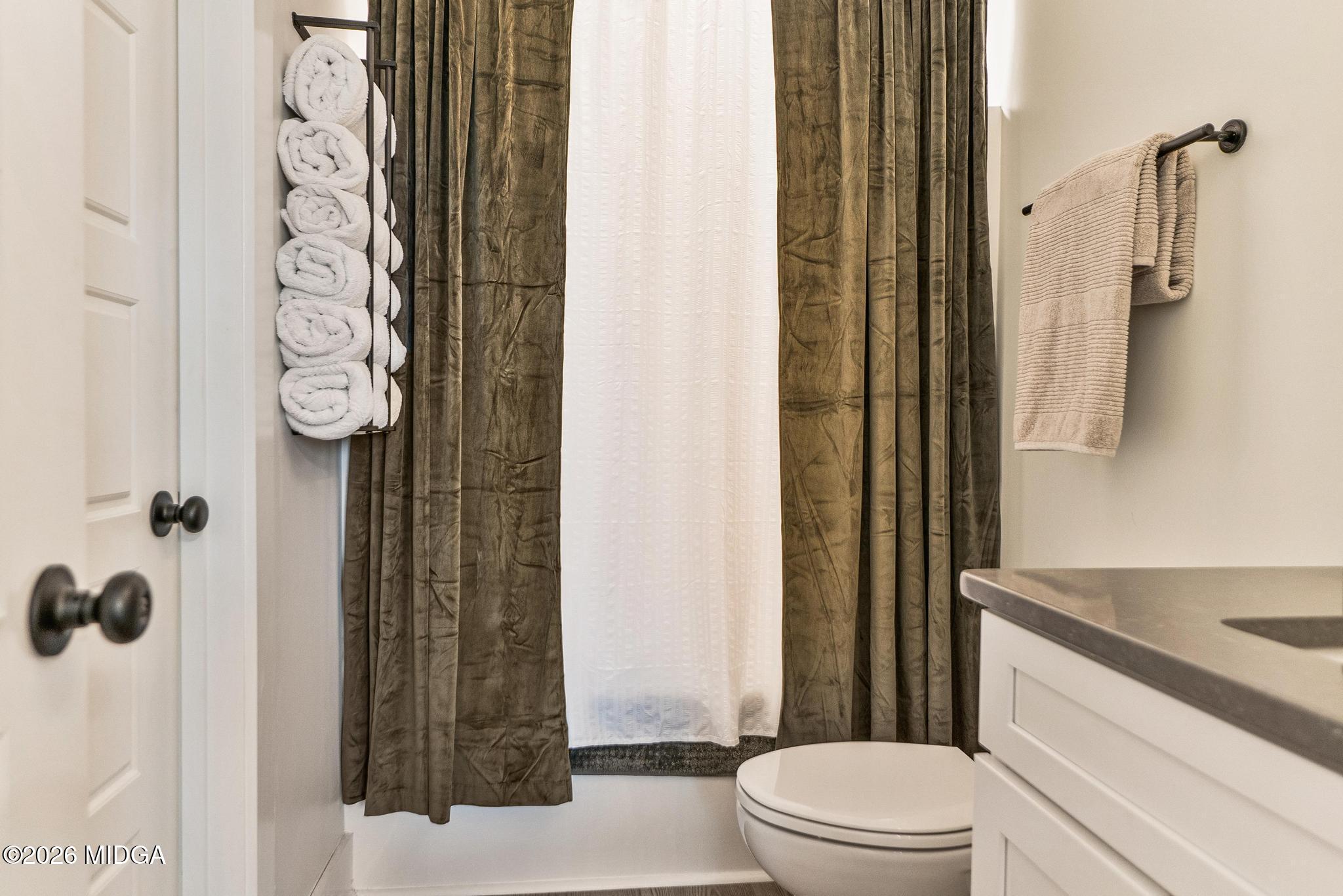 155 Creekside Lane Forsyth, GA 31029 - Photo 30 of 43 a bathroom with a sink a toilet and shower