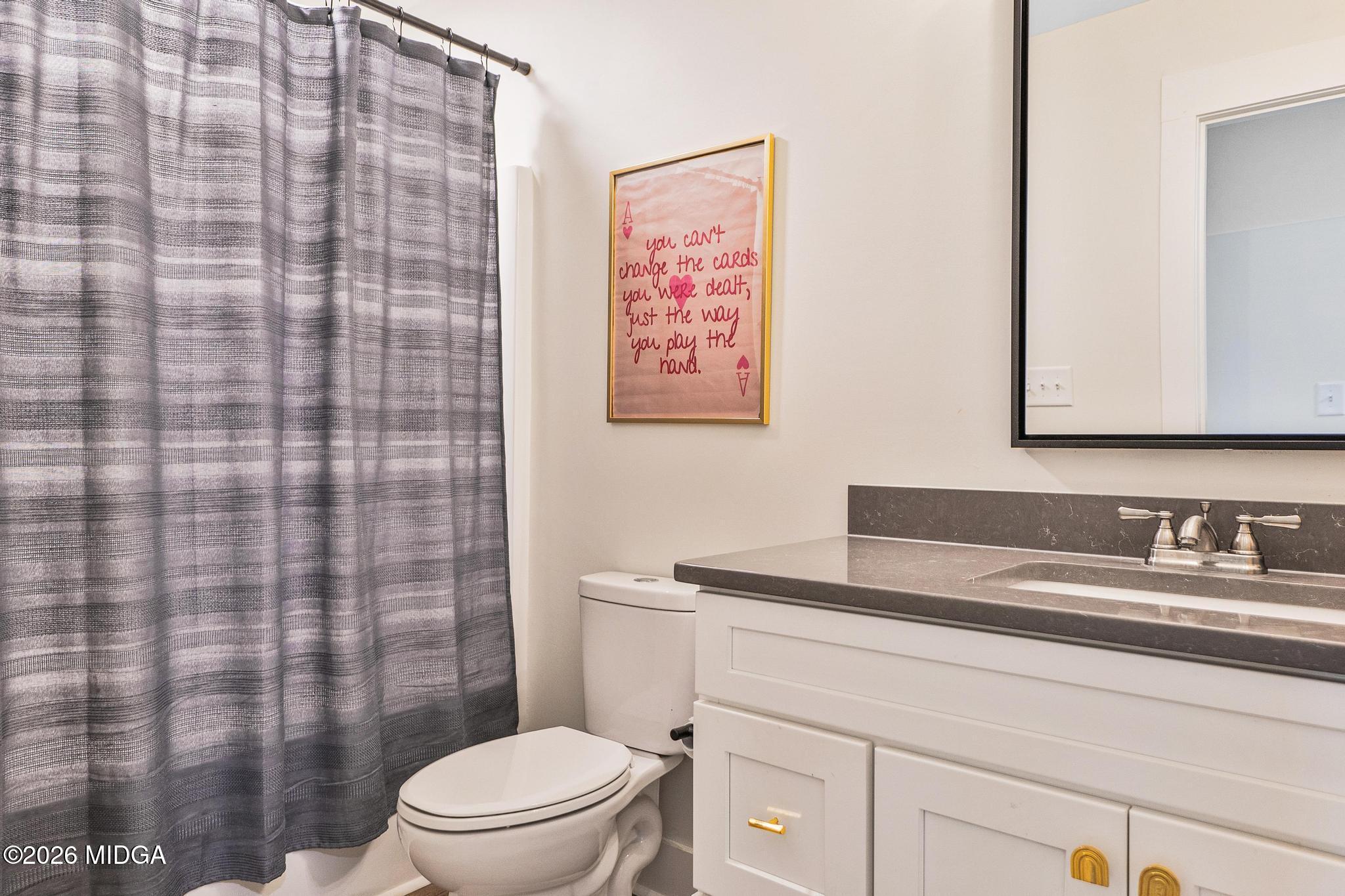 155 Creekside Lane Forsyth, GA 31029 - Photo 33 of 43 a bathroom with a sink a toilet and shower