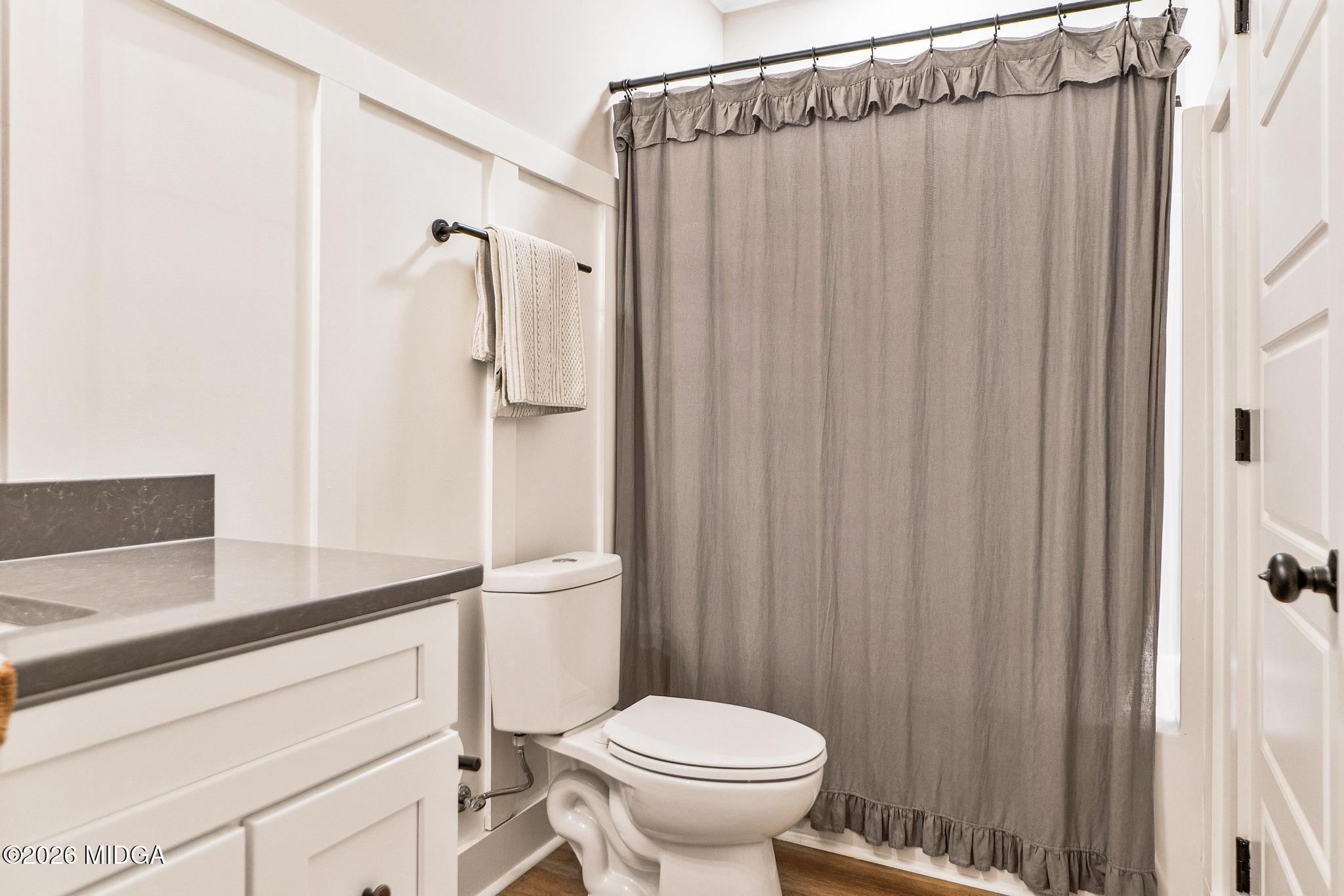 155 Creekside Lane Forsyth, GA 31029 - Photo 34 of 43 a bathroom with a sink a toilet and shower
