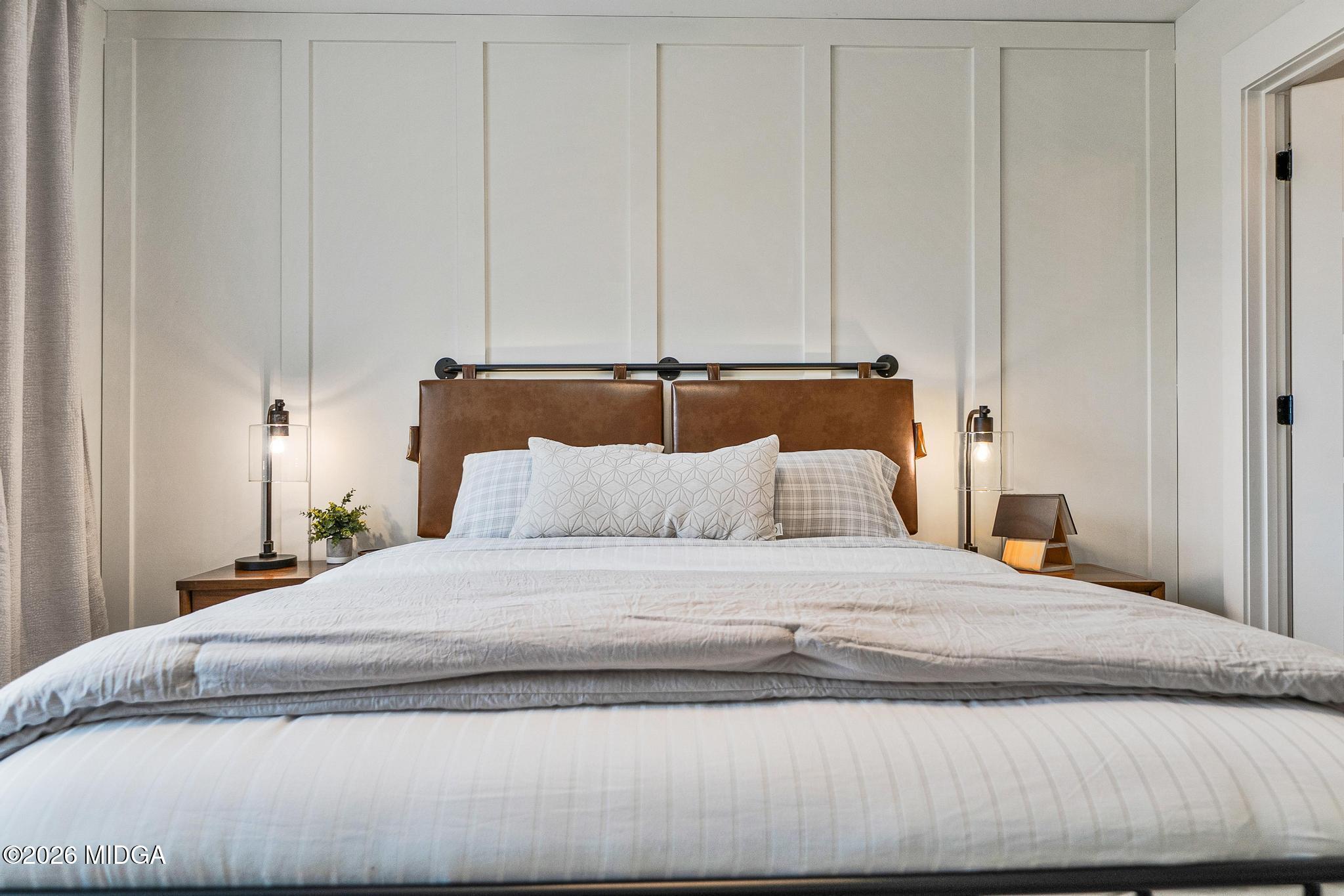 155 Creekside Lane Forsyth, GA 31029 - Photo 36 of 43 a bedroom with a bed and a night stand