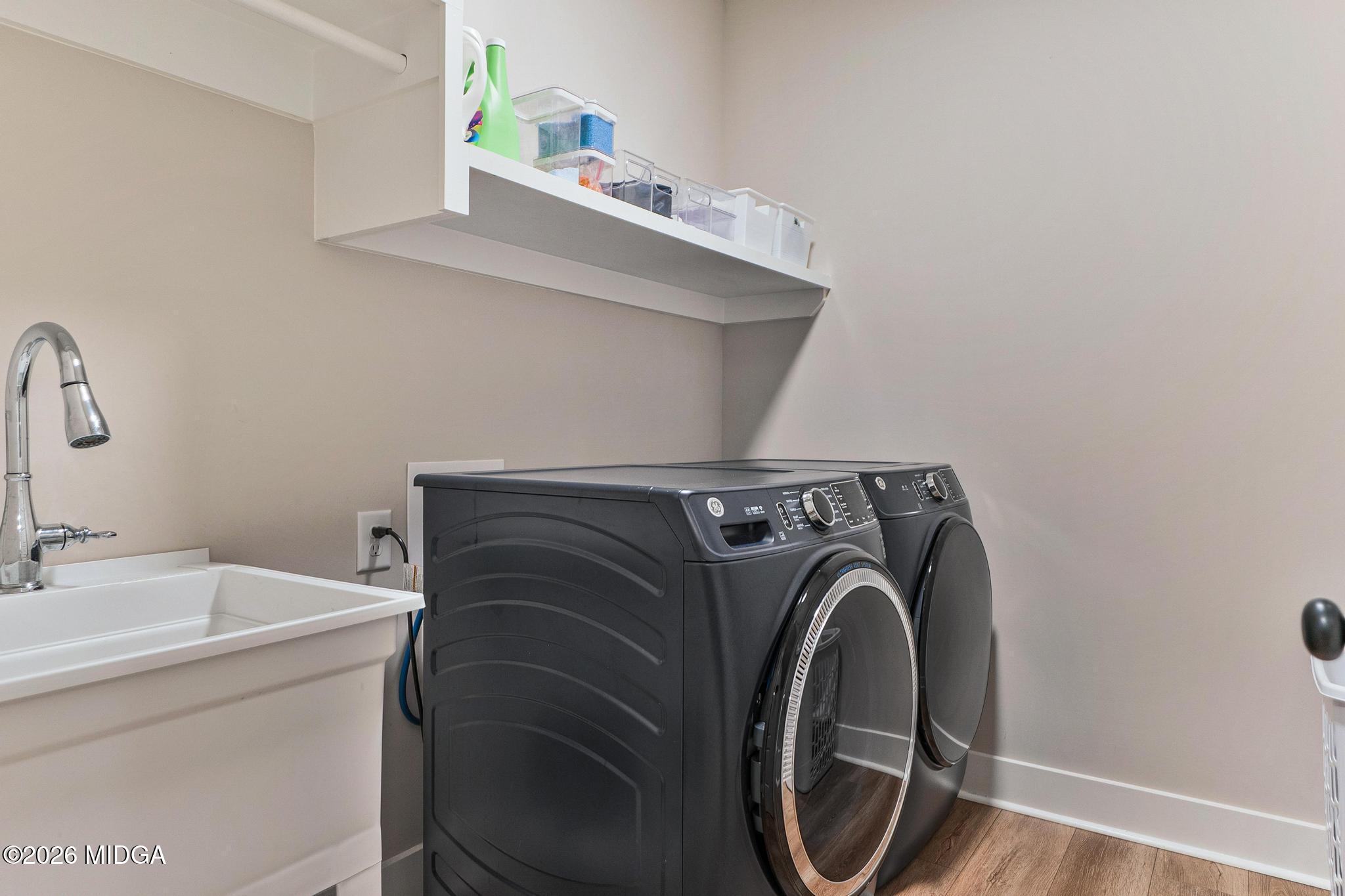 155 Creekside Lane Forsyth, GA 31029 - Photo 37 of 43 a utility room with dryer and washer