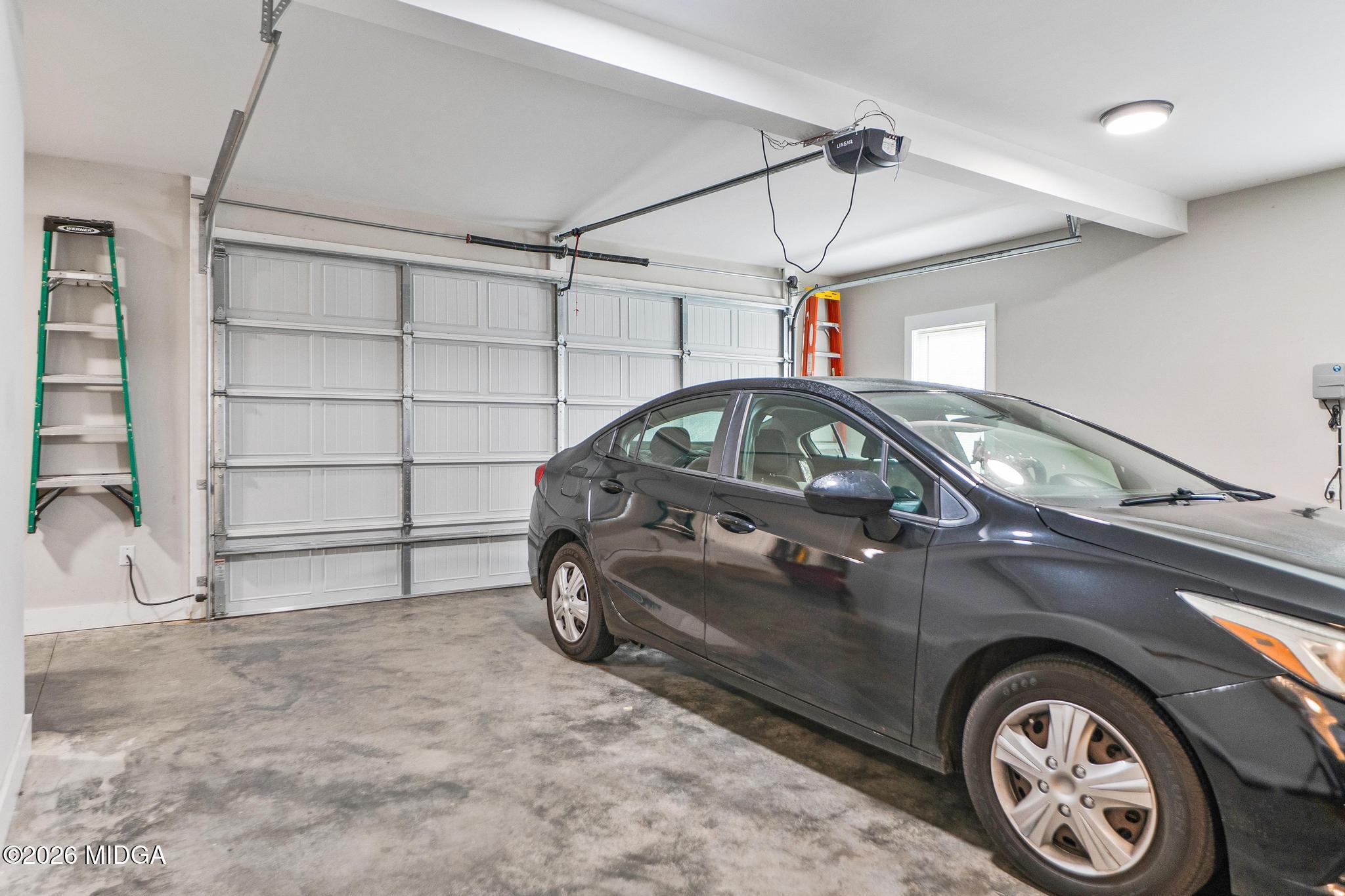 155 Creekside Lane Forsyth, GA 31029 - Photo 39 of 43 a car parked in a garage