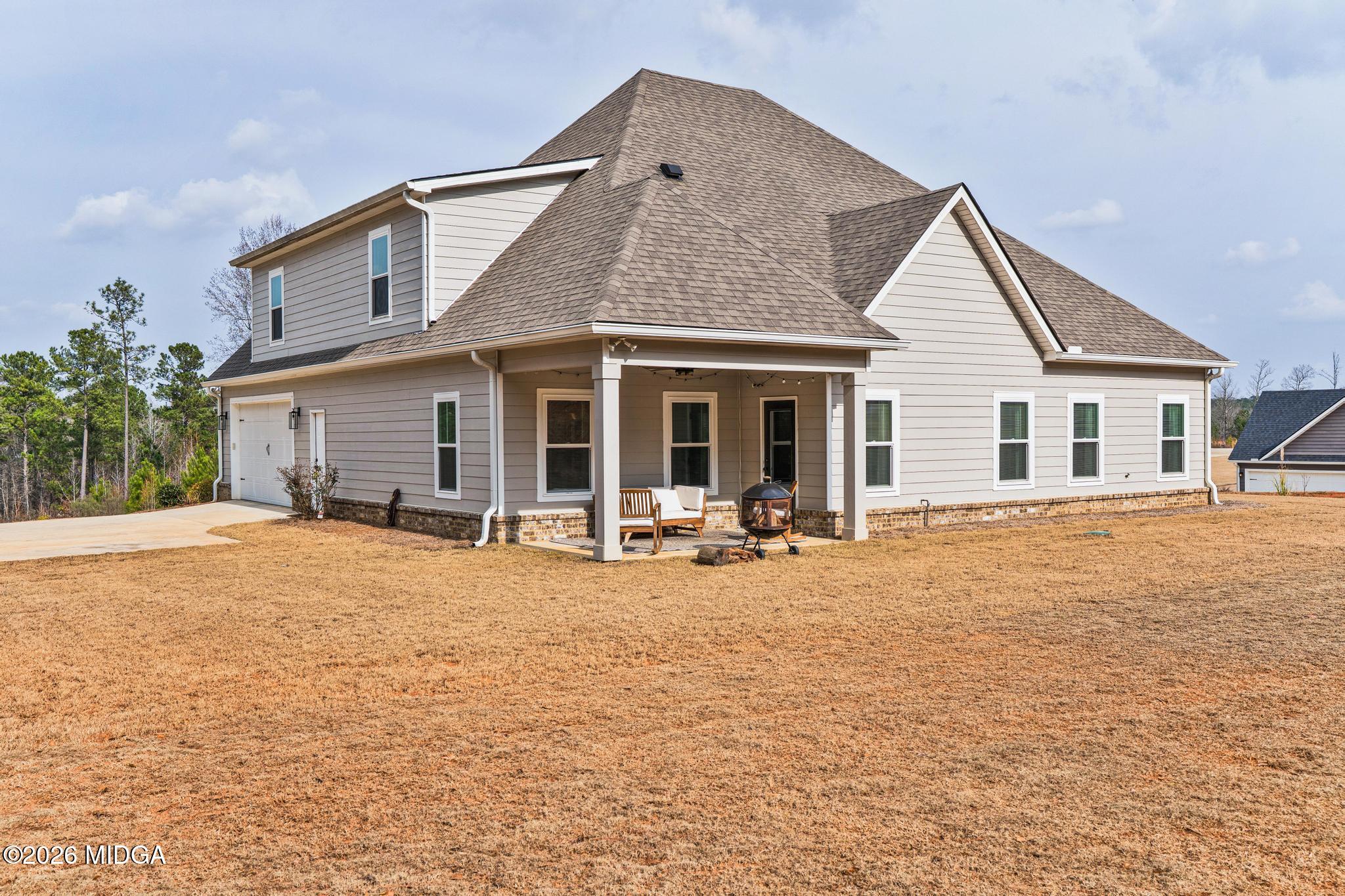 155 Creekside Lane Forsyth, GA 31029 - Photo 40 of 43 a house with pool and porch