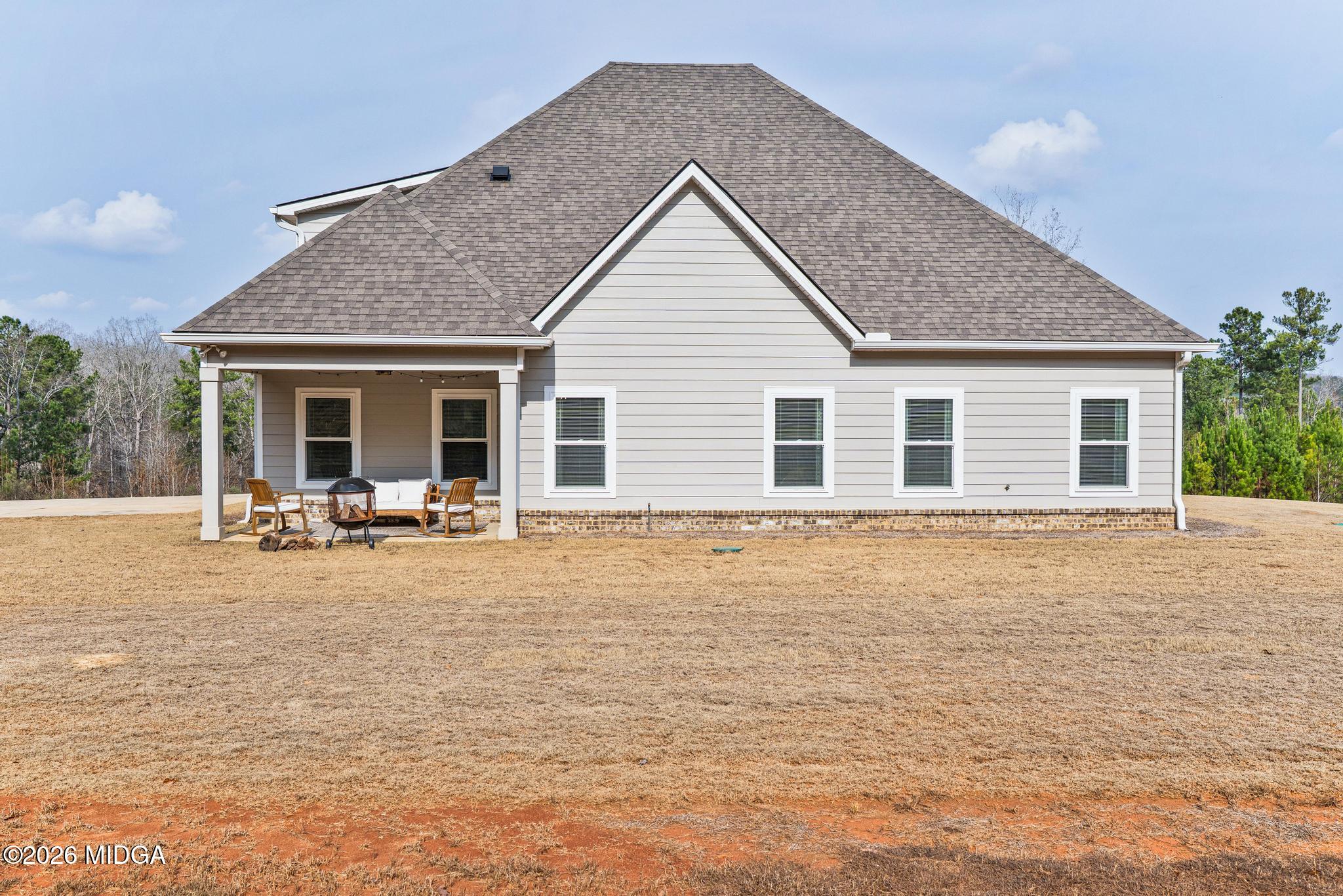 155 Creekside Lane Forsyth, GA 31029 - Photo 41 of 43 a view of a house with backyard and porch