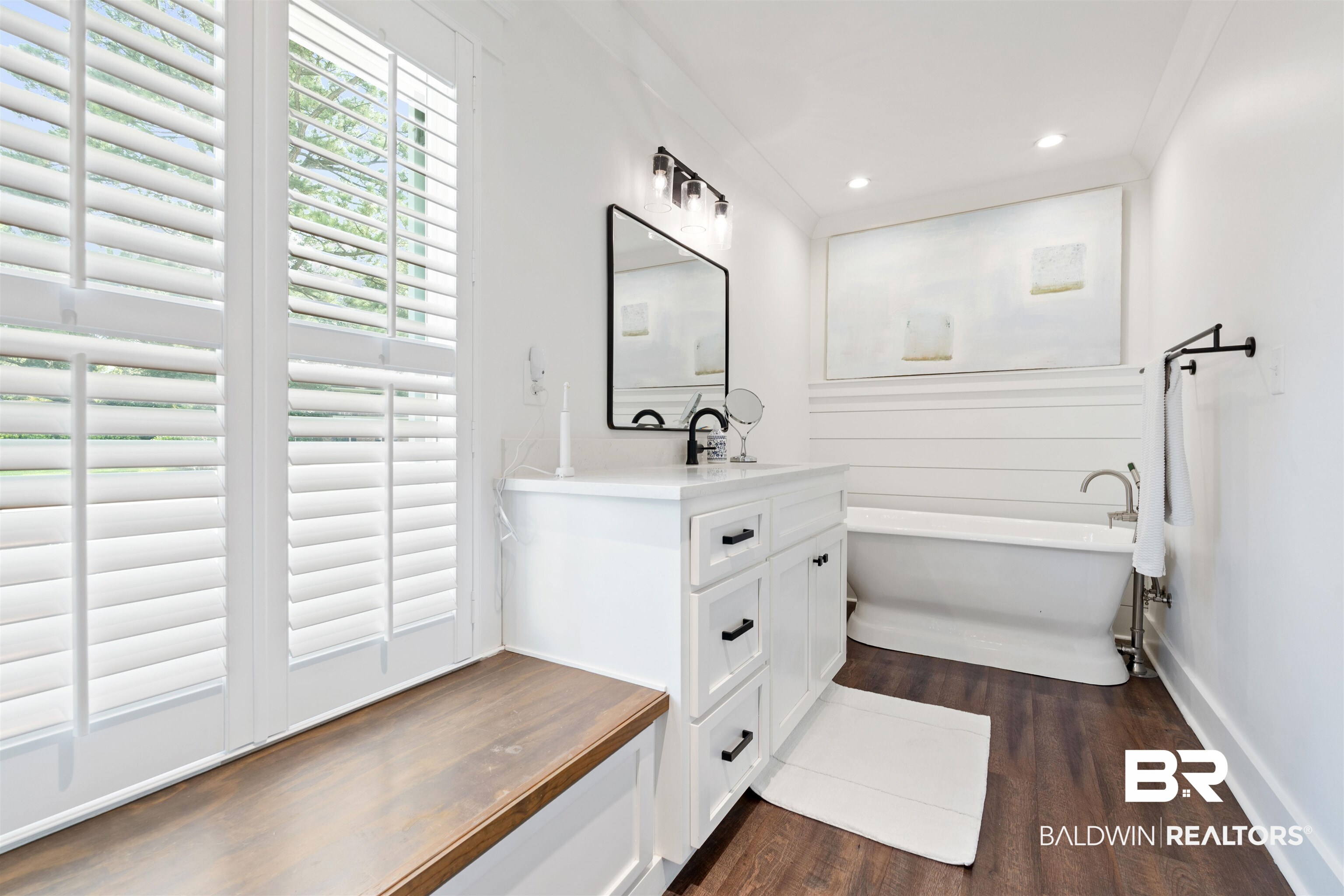 3808 Claridge Road North Mobile, AL 36608 - Photo 21 of 43 Bathroom with a washtub, wood-type flooring, crown molding, and vanity