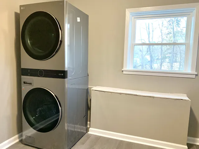 a view of a hallway with washer and dryer